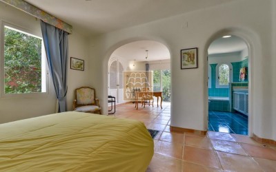 A beautiful villa in a peaceful, green setting.